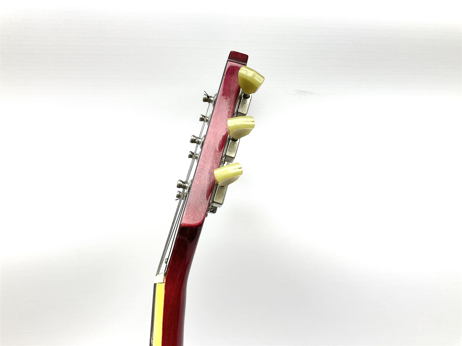 1980s Les Paul Epiphone limited edition cut-away electric guitar by Gibson, the burgundy coloured body with two pick-ups, volume and tone knobs and scratch plate, original tuning pegs, serial no.U6030215, 101cm overall; in modern Kinsman fitted carrying case