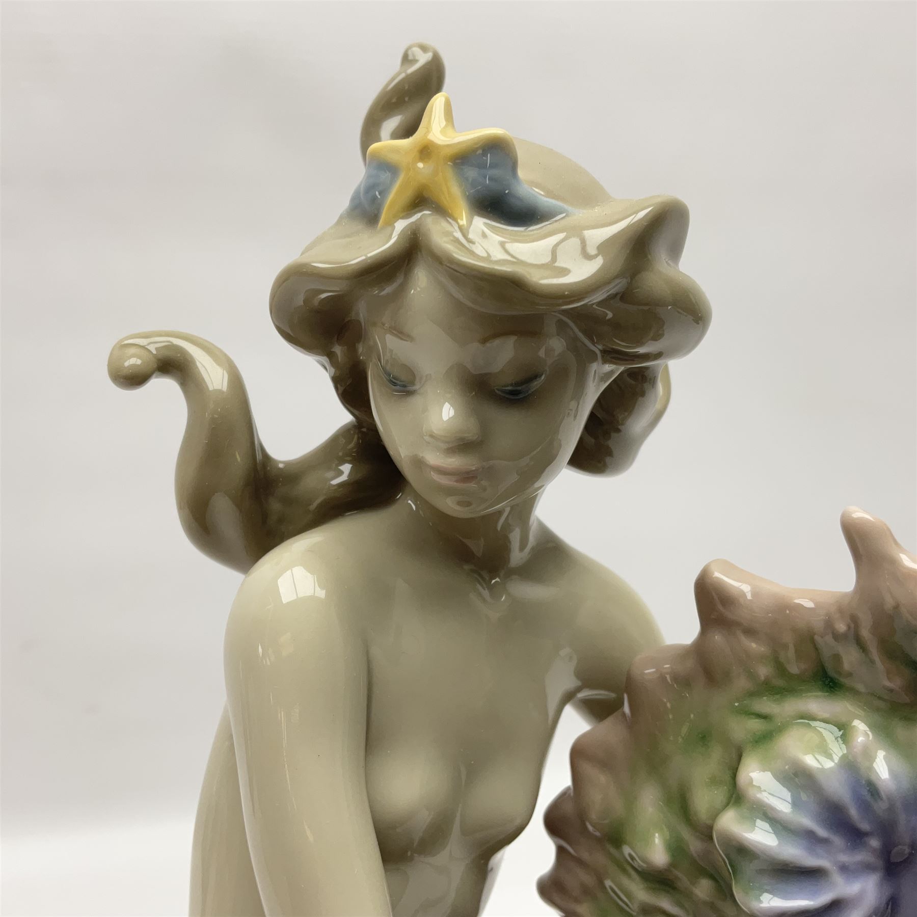 Lladro figure, Beneath the Waves, modelled as a mermaid and seahorse upon a wooden plinth, no 1822, limited edition 1389/2500, with certificate and original box, H32cm 