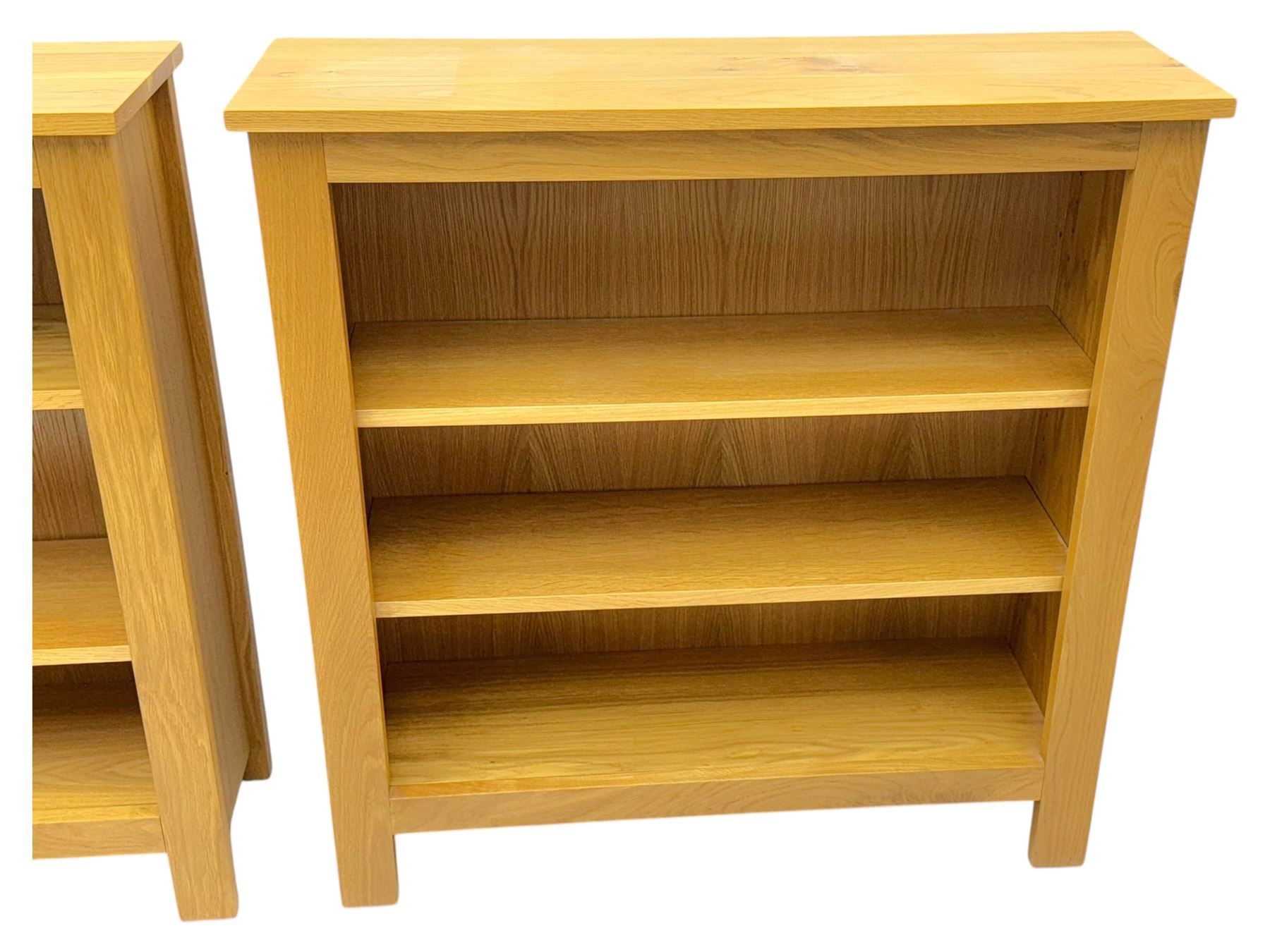 Five light wood open bookcases, four with two adjustable shelves, (W89cm, D29cm, H94cm), one with one adjustable shelf (W89cm, D29cm, H77cm)  
