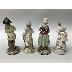 Four 20th century continental figures, comprising woman in period dress with lace detail holding a fan, man in formal dress with lace detail, leaning on a stick, a man playing the violin and a woman holding a letter, all on scrolled bases with gilt detail, tallest example H16cm