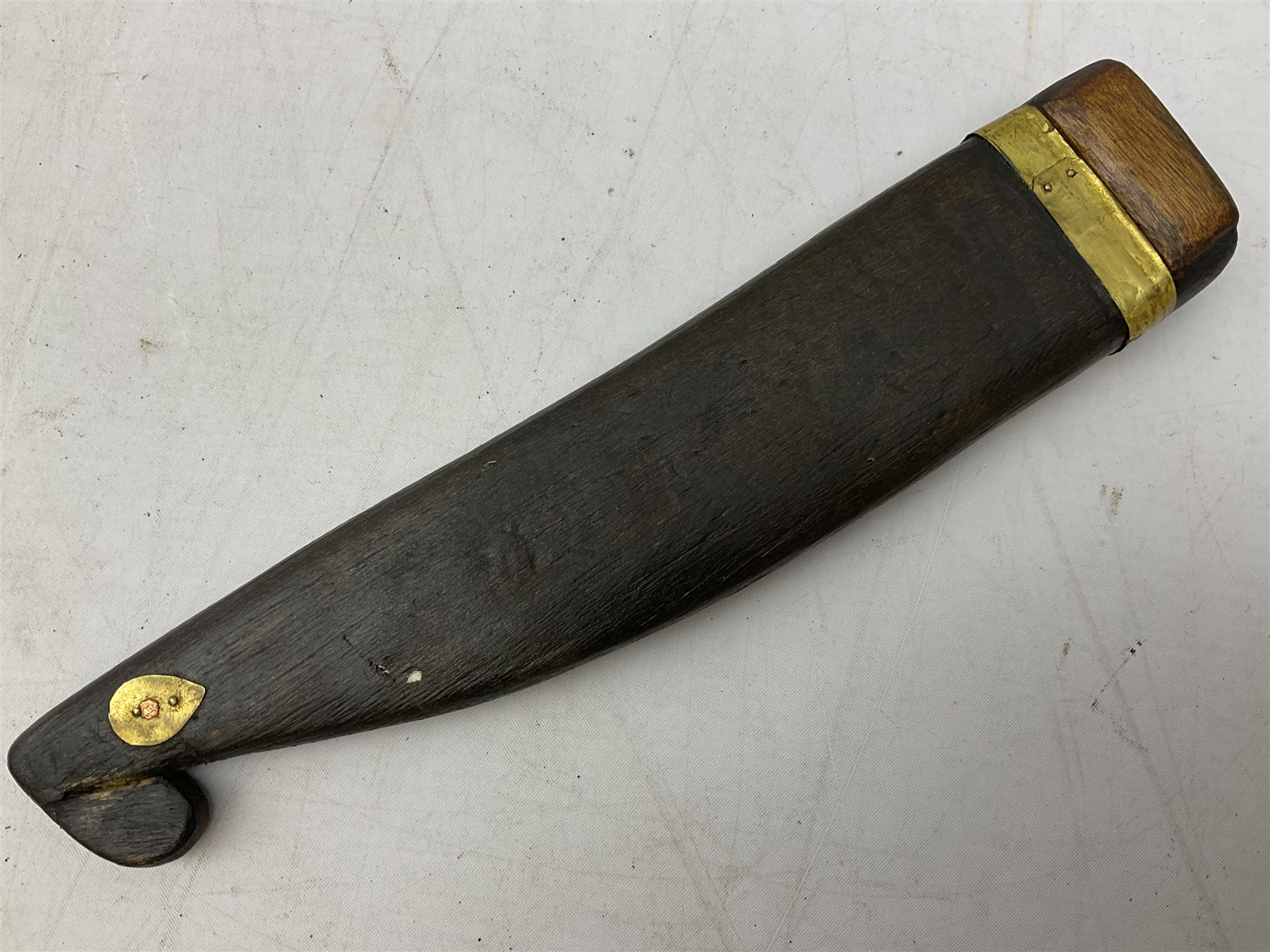 19th century Singhalese knife pia kaetta, the 20cm steel blade inset with yellow and white metal, with metal mounted carved pistol grip, in plain wooden scabbard L33cm overall