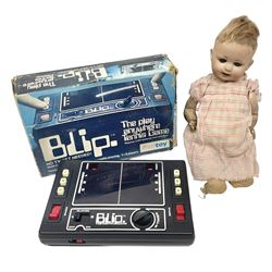 Palitoy Blip electronic game; boxed; and 1920s German Hermann Steiner bisque head doll with applied hair, sleeping eyes, open mouth with upper teeth and composition body with jointed limbs; marked with HS monogram and 6/0; H26cm (2)