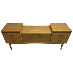 Mid-20th century oak drop-centre dressing table or sideboard, fitted with four drawers and central double cupboard, on tapering supports