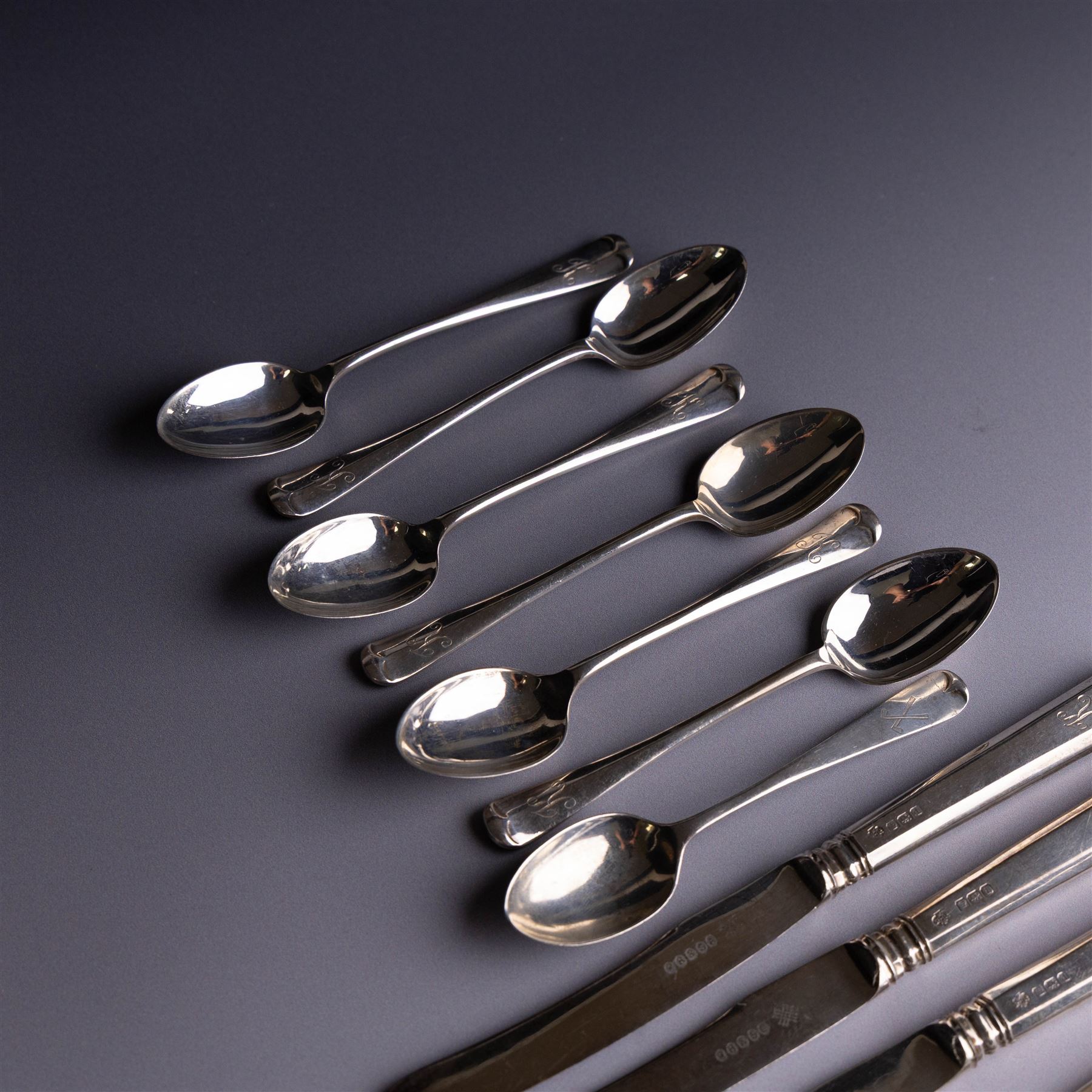 Set of six silver teaspoons with engraved initial K to finial, together with a set of six silver handled tea knives and one further silver teaspoon, all hallmarked