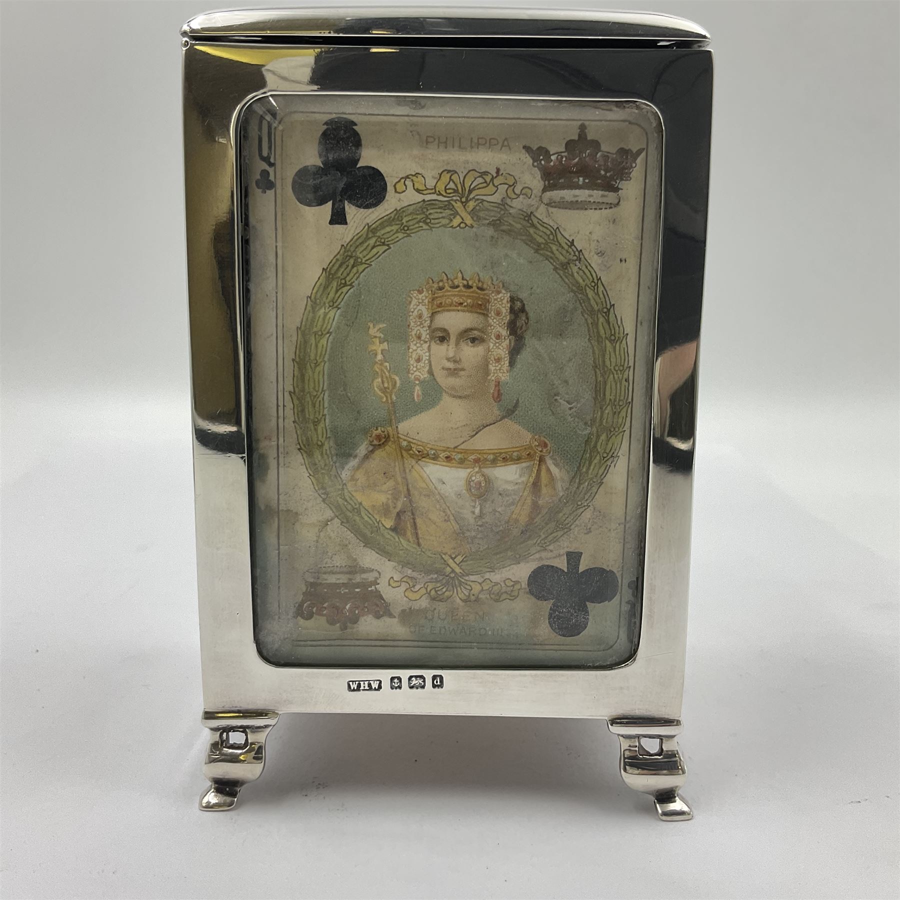 Edwardian silver mounted playing card case, hallmarked William Harrison Walter, Birmingham 1903, the sides each with a period playing card set behind a bevelled glass panel, the hinged cover with later engraving 'Presented to Norman T Crombie Esq by the officers & men of the 31st WR Detachment for services rendered 1917-1918', with red leather lined interior, the three compartments upon a sprung base and containing two later wooden Whist markers, case H12.5cm
