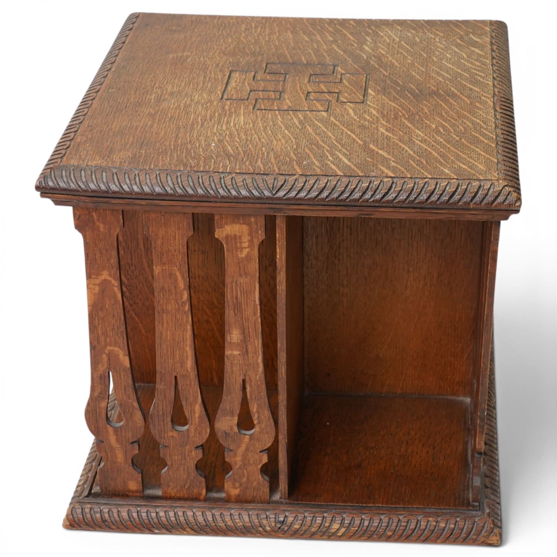 Early 20th century tabletop oak revolving bookcase, of square section upon short platform base 