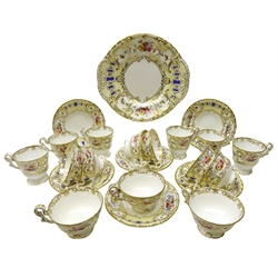  19th century Copeland and Garrett 'Berlin' part tea service, hand painted panels of floral sprays and butterflies, within an moulded gilt border on yellow ground, comprising eight tea cups, six coffee cups and saucers and cake plate (22)  