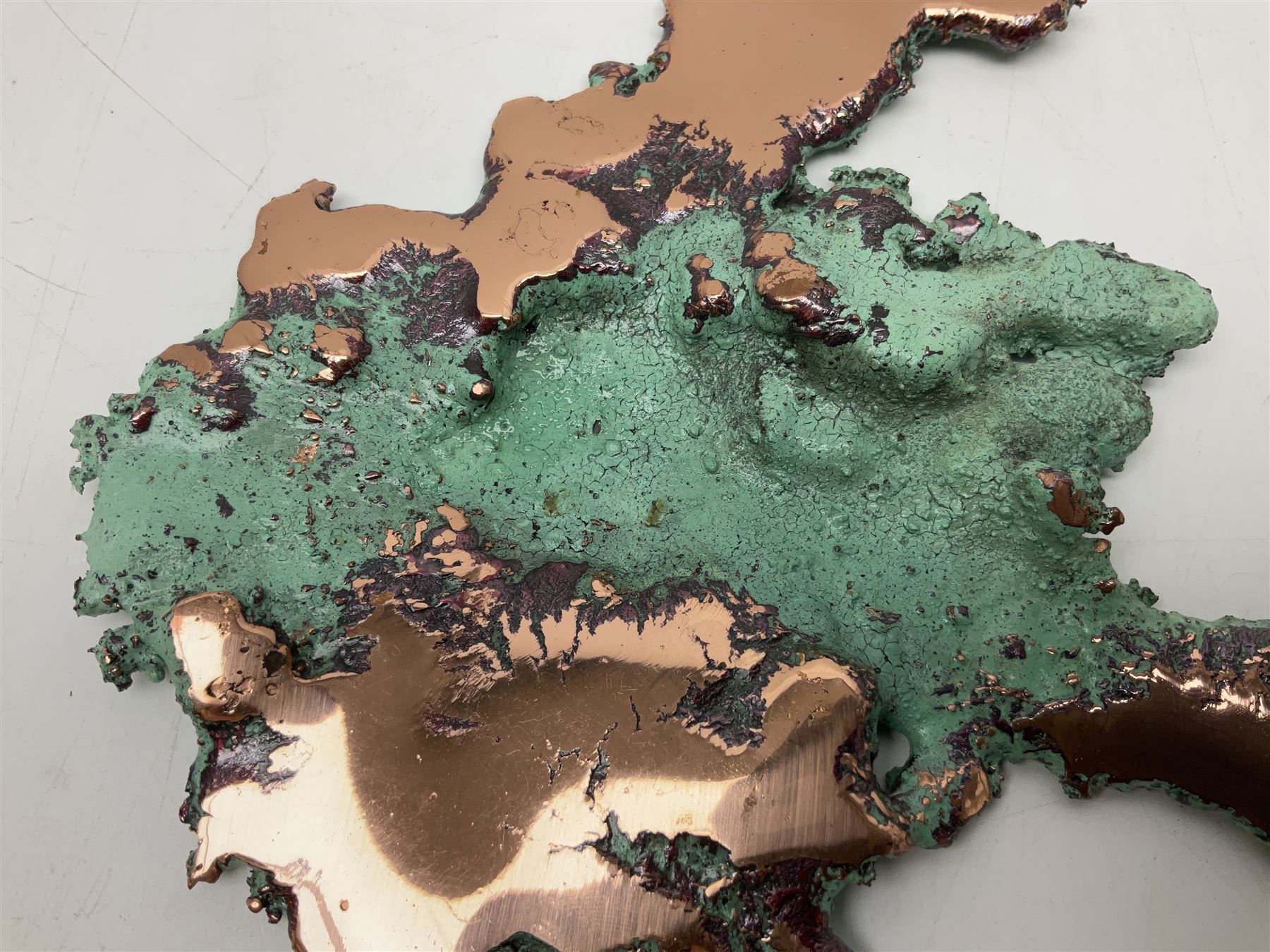 Large free form copper splash, with green patina and polished copper accents, at largest point H16cm, L18cm
