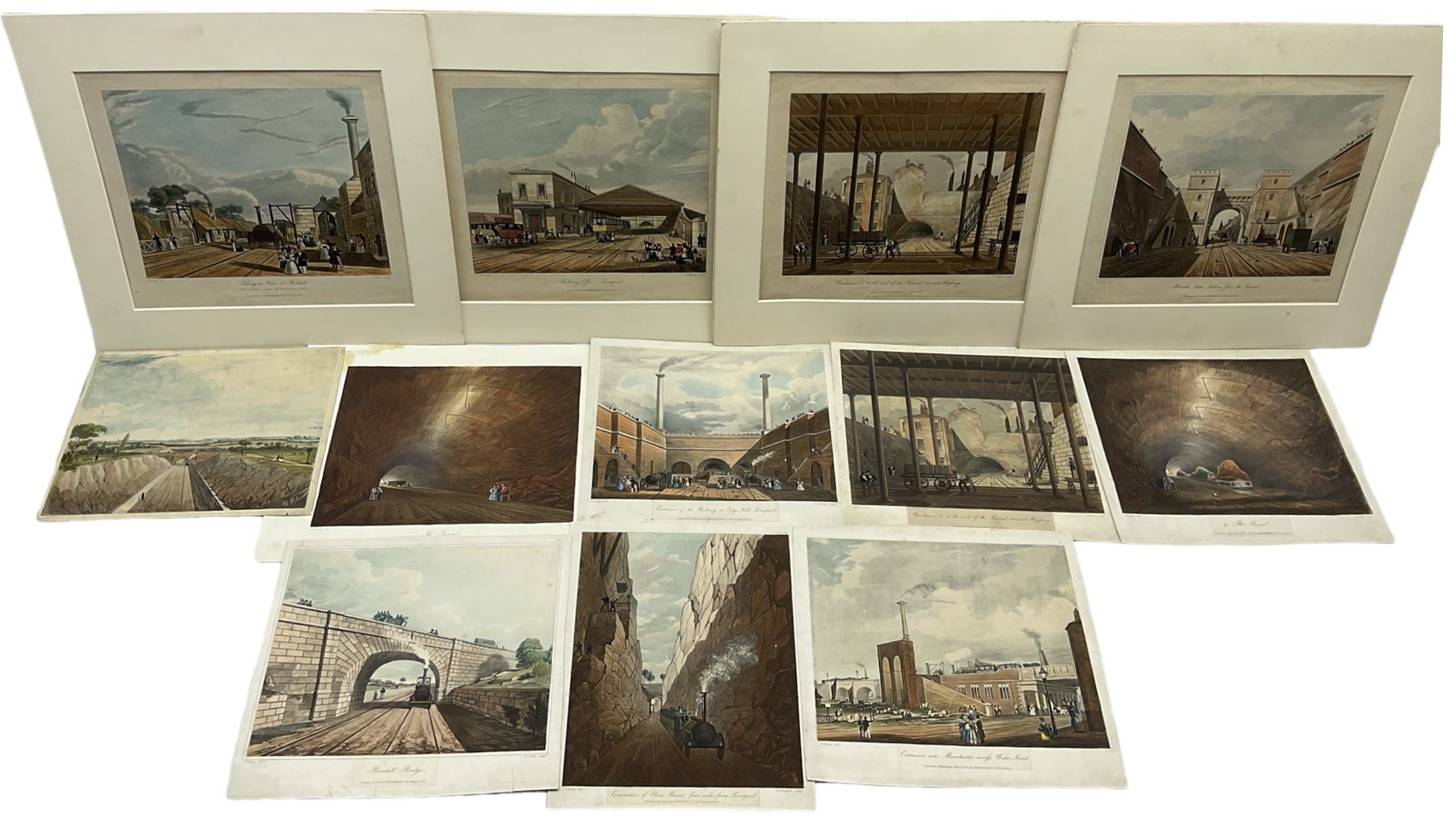 Henry Pyall and S G Hughes after Thomas Talbot Bury (British 1811-1877): Views on the Liverpool and Manchester Railway, twelve aquatints (two doubled up) with hand colouring pub. Ackermann c.1831-1833, 20cm x 25cm (12) (unframed)
Notes: Plates consist of: '[1] The Tunnel' (x2) (both 1831 and 1833 editions), '[2] Entrance of the Railway at Edge Hill Liverpool', '[3] Excavation of Olive Mount four miles from Liverpool', '[6] Entrance into Manchester across Water Street', '[8] Railway Office Liverpool', '[9] Warehouses at the end of the Tunnel towards Wapping' (x2) (both 1831 and 1833 editions), '[10] Moorish Arch looking from the Tunnel' '[11] Near Liverpool looking towards Manchester', '[12] Rainhill Bridge', '[13] Taking in Water at Parkside'.