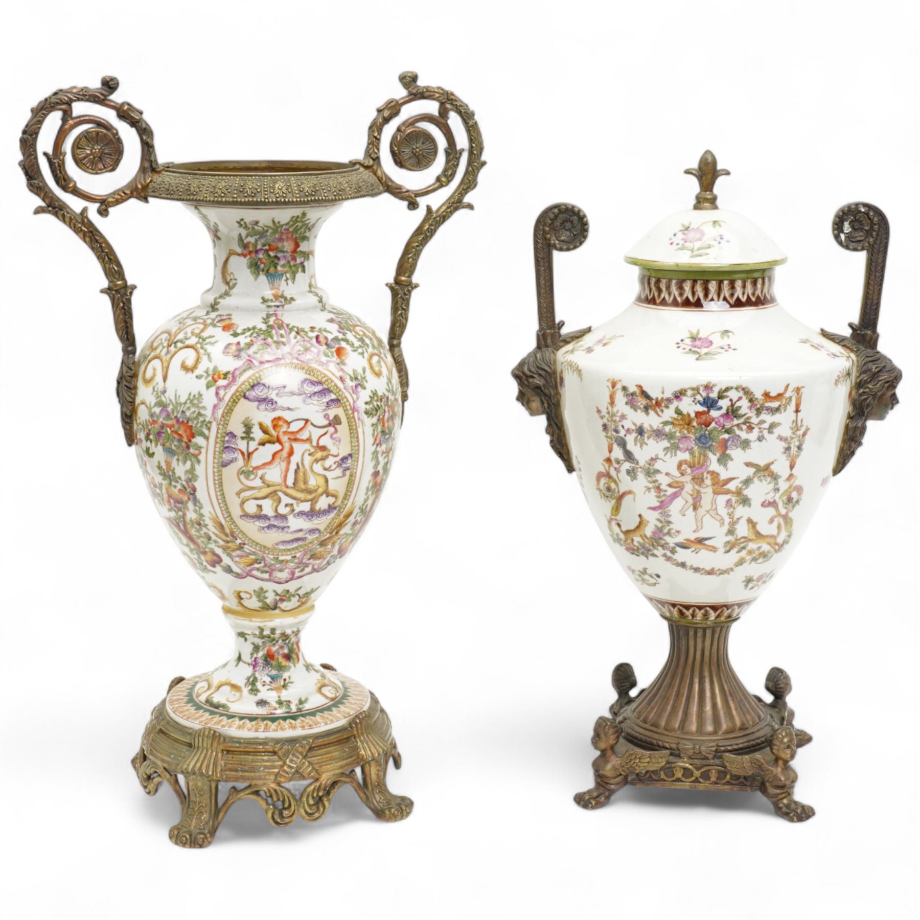 Wong Lee twin handled ceramic urn, with enamelled cherubs among animals and foliate decoration with bronzed metal mounts, upon a square base with paw feet, together with similar twin handled urn with enamelled floral decoration, marked to base, largest H48cm (2)