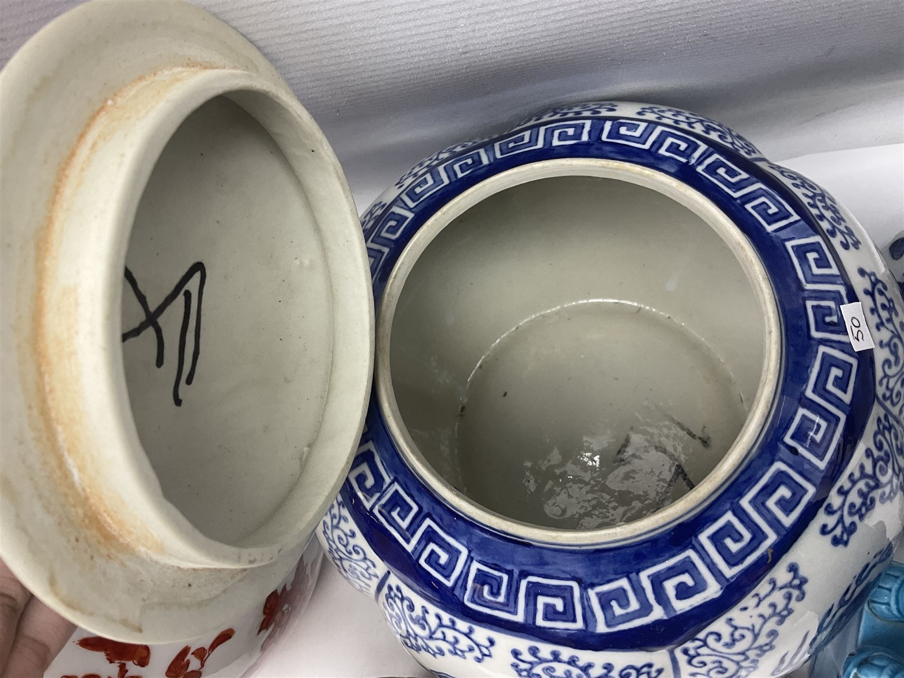 Chinese turquoise glazed foo dog, together with Yang Cheng iron red ginger jar, snuff bottle, and other oriental ceramics 