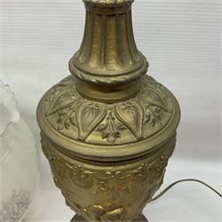 Gilt metal table lamp, heavily embossed with flowers and butterflies, with fluted frosted glass shade, H56cm