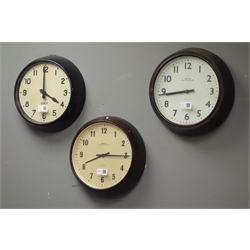  Early 20th century 'Smiths' bakelite slave clock, another 'Smiths' slave clock and a 'Gents' of Leicester' slave clock  