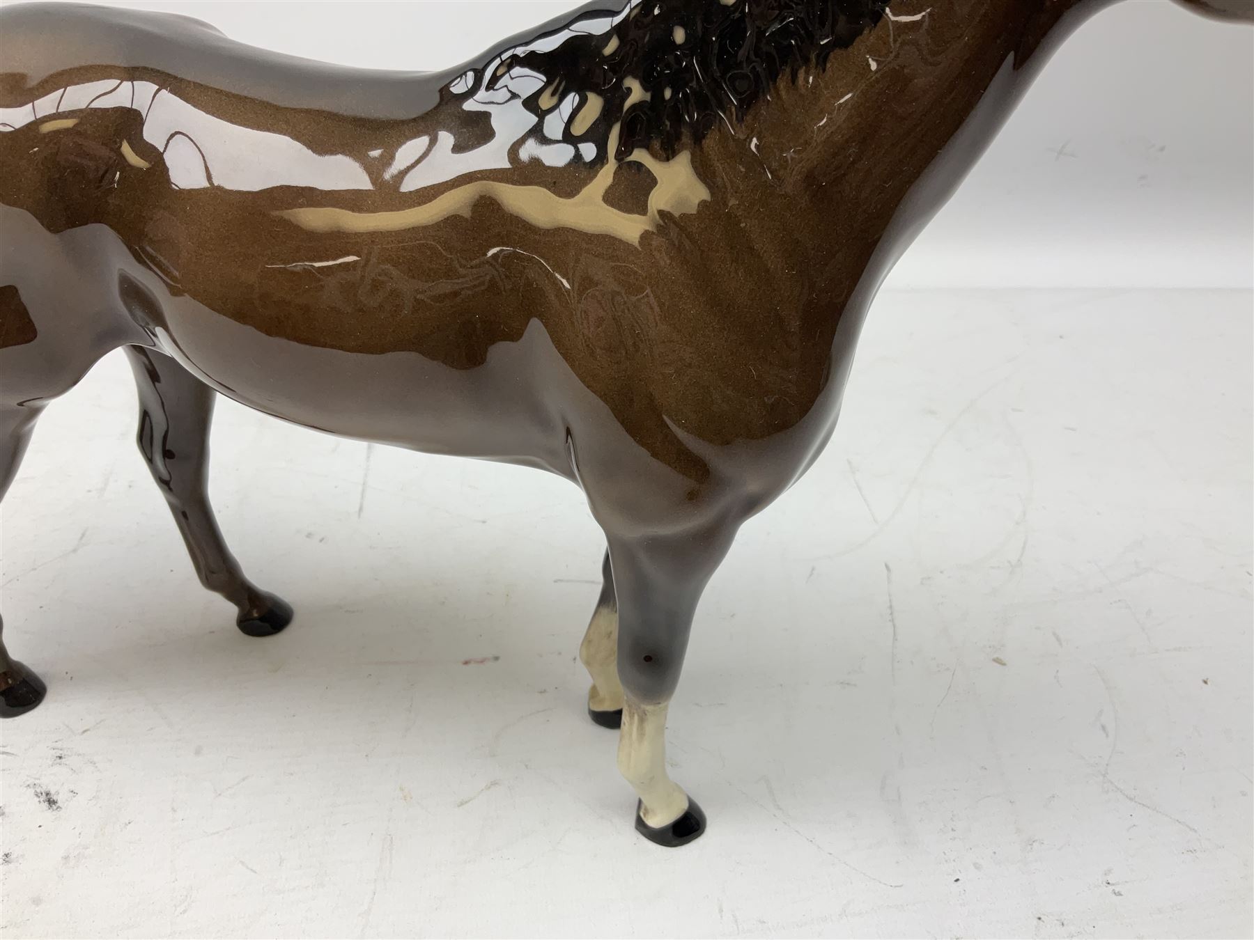 Six Beswick figures of bay horses, including large hunter no.1734, Shire horse no.818, horse with tucked head no.1549, etc (6)