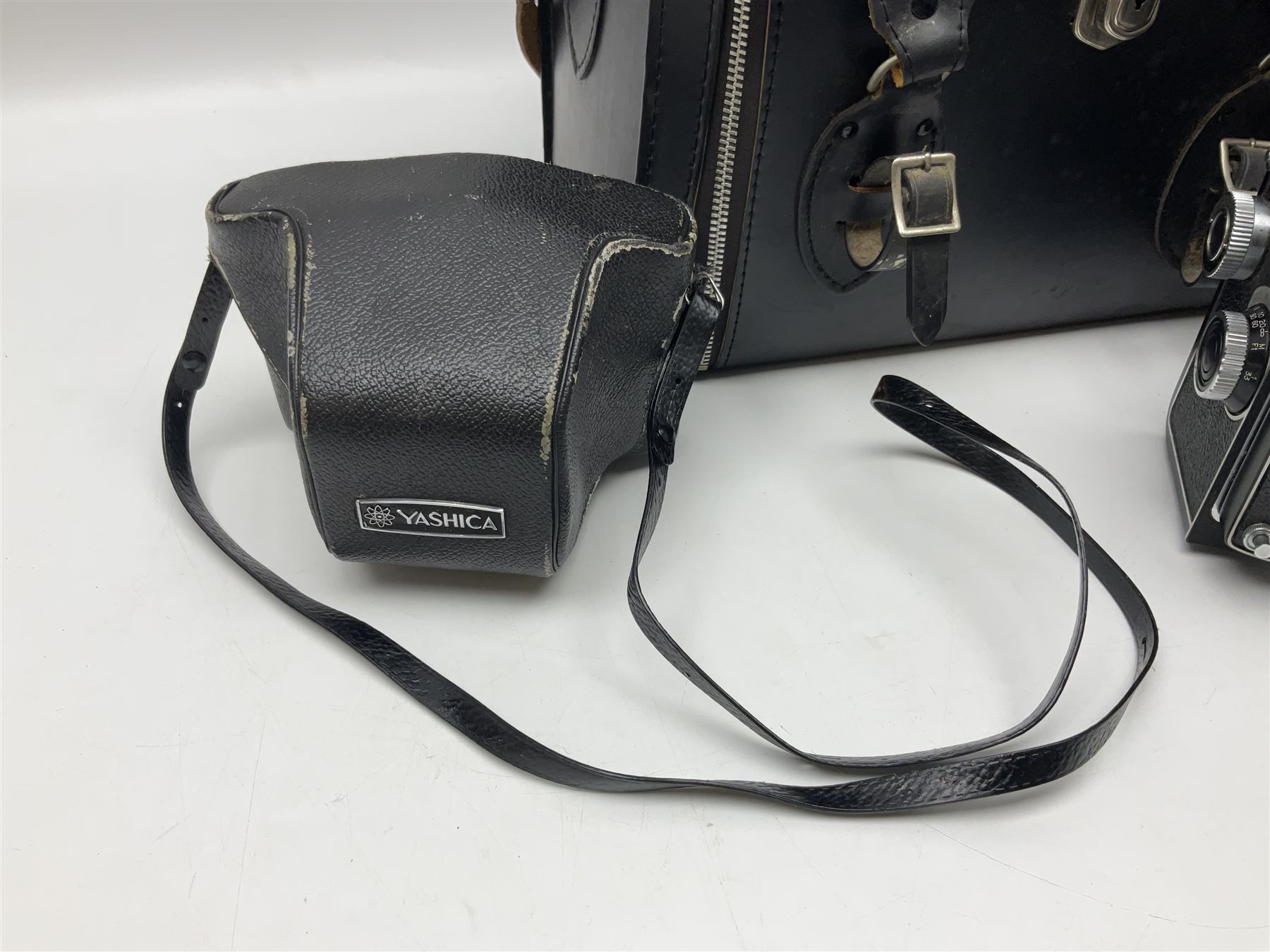 Yashica-A camera body, serial no. A4080073, with 'Yashikor 1:3.5 f=80mm' lens, serial no. 209272 and 'Yashikor 1:3.5f=80mm' lens, serial no 22942, together with Yashica TL-Electro camera body, serial no. 5054162 with 'Yashinon-DS 50mm 1:1.9  40056038