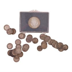 Approximately 39 grams of Great British pre-1920 and approximately 22 grams of Great British pre-1947 silver coins, mainly threepences, together with a United States of America 1964 'Kennedy' silver half dollar and two small silver coins