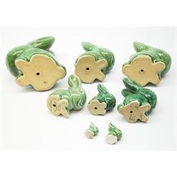 A collection of eight Denby green glazed models of the Rabbits Marmaduke and Cotton tail, various sized, largest H20.5cm, some marked. 