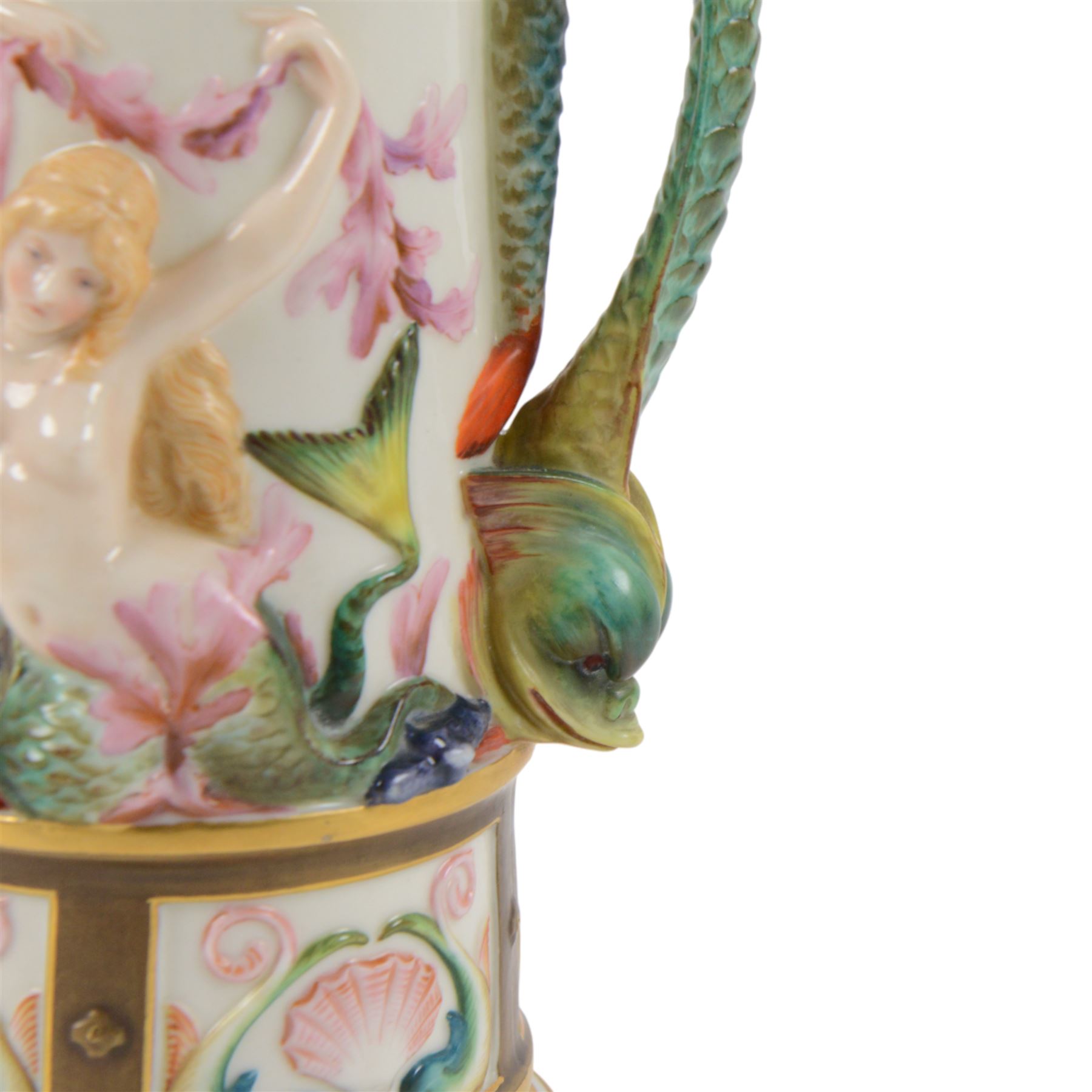 Royal Worcester Neptune pitcher, decorated in relief with mermaids, shells and seaweed above a panelled band of dolphins and shell, dolphin modelled handle and Neptune mask spout, with green mark beneath, H25cm