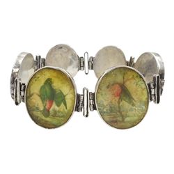 19th century silver oval link bracelet, each link with a painted ivory plaque depicting birds amongst landscapes