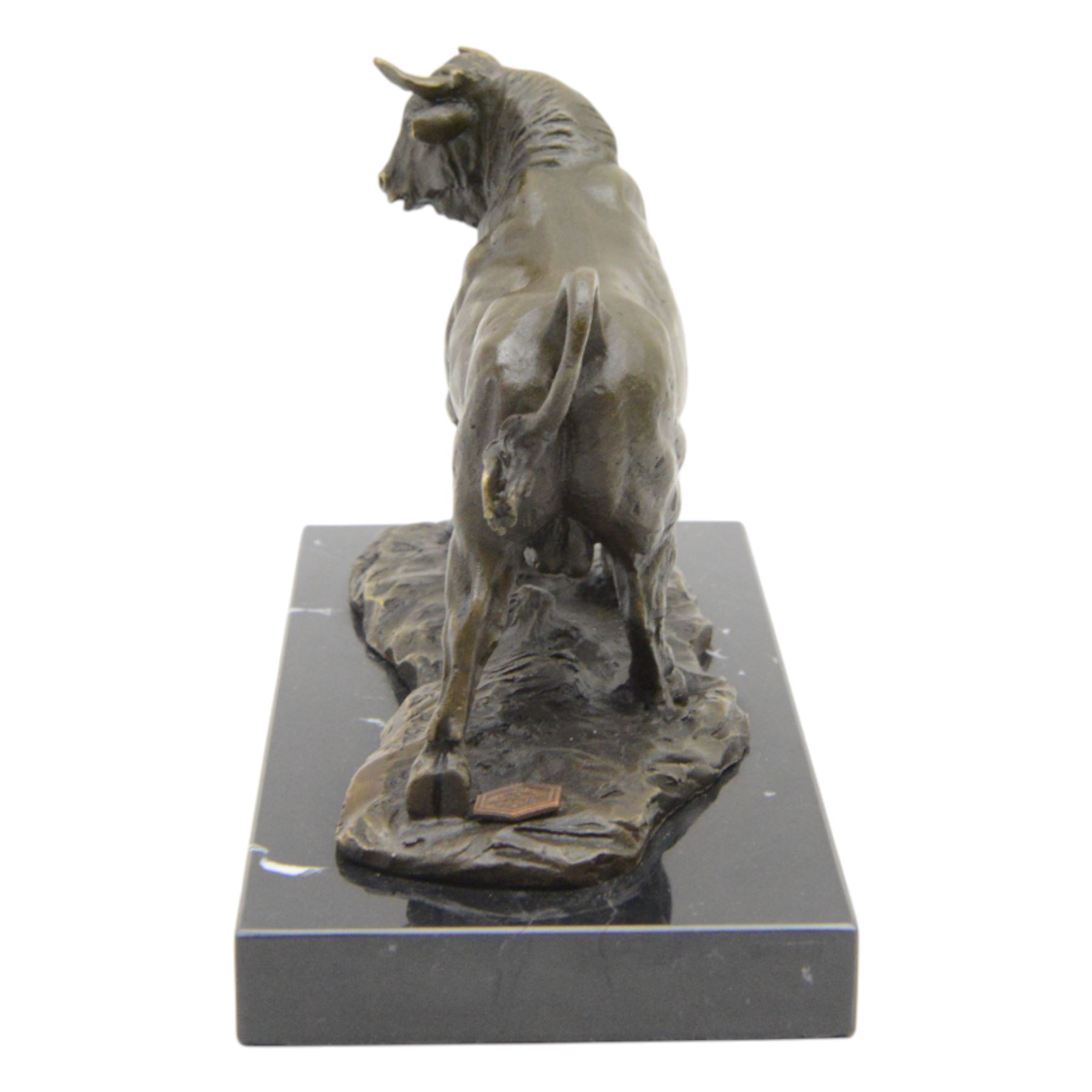 Bronze figure, modelled as a prancing bull, upon a naturalistic base signed Mils and with foundry mark, raised upon a rectangular marble base, overall H14cm