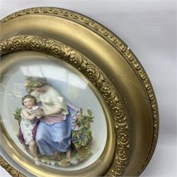 Set of four early 20th century Continental bisque plaques, each of circular form, modelled in high relief as the Four Seasons personified, within gilded circular frames under convex glass, overall D44.5cm