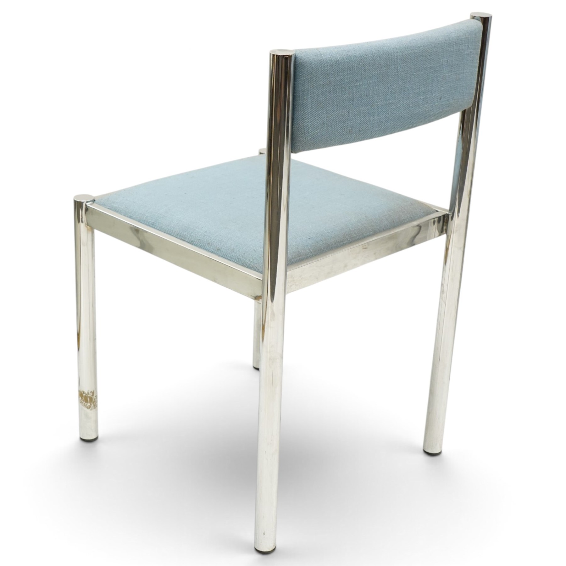 Set of eight 1980s chrome and upholstered dining chairs, curved back bar over padded seats upholstered in blue fabric, on tubular chrome frames