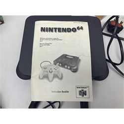 Nintendo 64 console, two controllers, games and accessories. Accessories to include the ‘Tremorpak’ and ‘Spook’ 2 Phono plugs and a S-VHS plug with adapter, both in original boxes. Games to include ‘Golden Eye 007’, ‘Doom 64’, ‘Killer Instinct Gold’, ‘Tetrisphere’, ‘F-1 World Grand Prix’, ‘Pilotwings 64’ and ‘Lylatwars’ with ‘Rumble Pak’, all with original boxes and instruction manuals. ‘Star Wars Episode I Racer’ game cartridge in Shadows of the Empire box. 