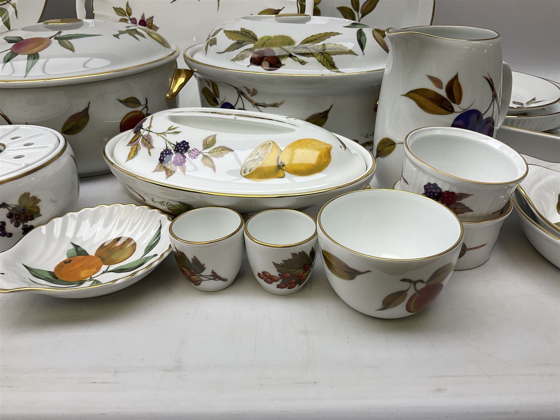 Royal Worcester Evesham pattern dinner wares, to include lidded tureens, eight dinner plates, serving tray, ramekins, jug, seven bowls, egg cups, serving dishes etc, approx 47 pcs, all with printed marks beneath