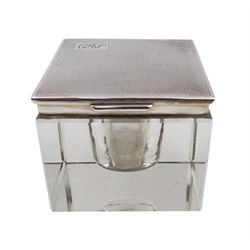 1930s silver mounted glass inkwell, of square form, the silver lid with engine turned decoration and engraved initials, hallmarked Adie Brothers Ltd, Birmingham 1937, H4.7cm