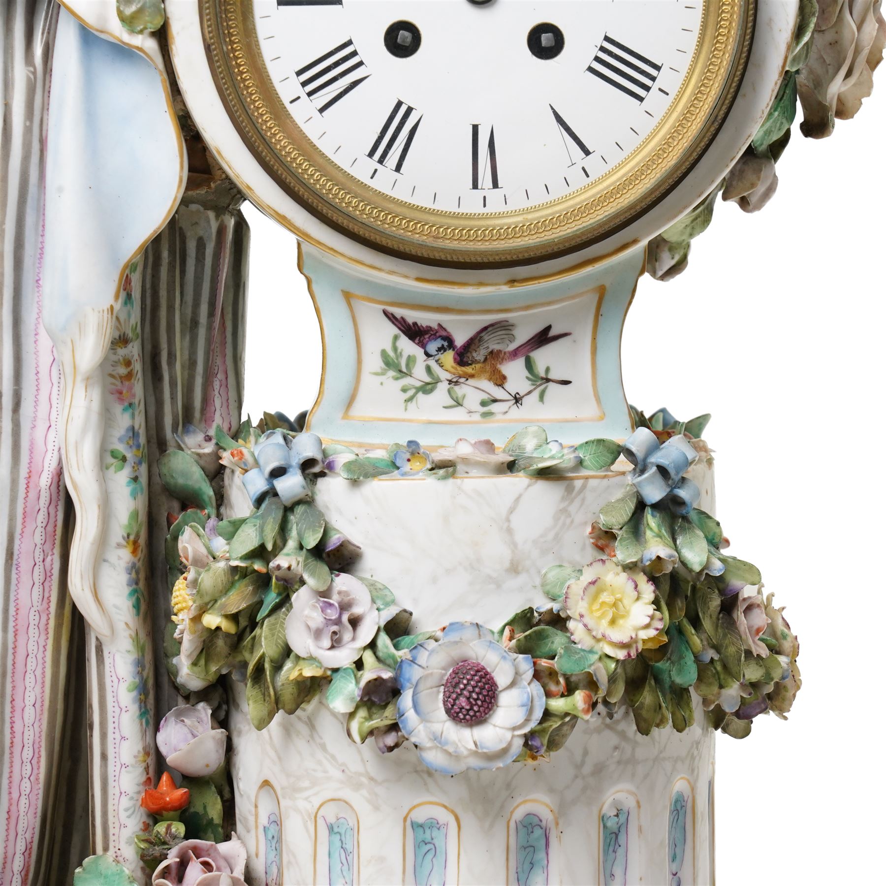 Large19th century  German porcelain mantel clock with white dial and striking movement, the case with a standing figure of Flora resting on a pillar with floral applied decoration, the base painted eith landscape and floral panels on paw feet H77cm W43cm
