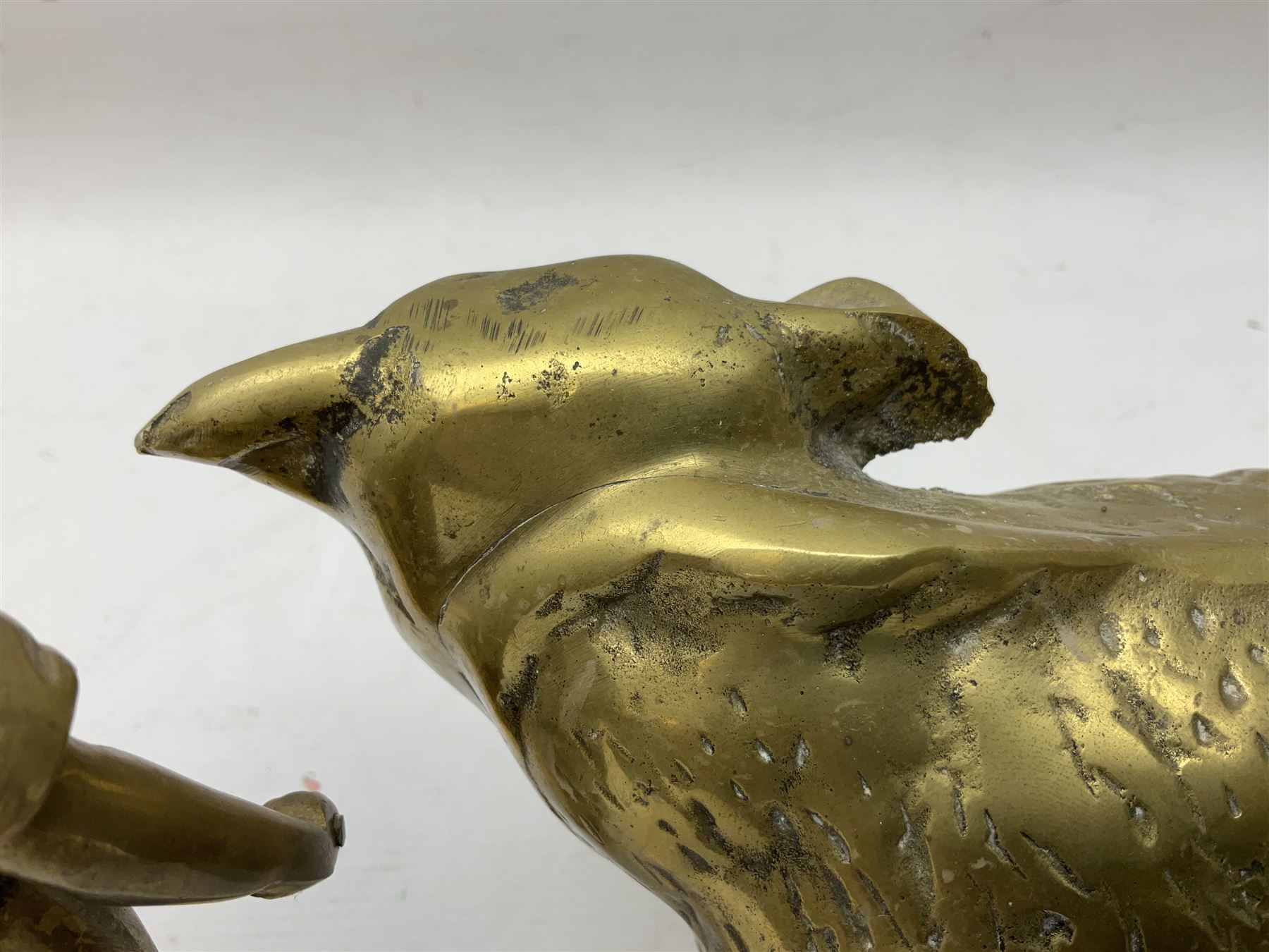 Large brass figure of a hereford bull, together with a brass figure of a blacksmith, bull H15cm