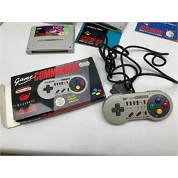 Two Super Nintendo Entertainment System (PAL) controllers, accessories and games. Super NES Game Commander with original box and instruction booklet, Super NES Nintendo Scope (1992) transmitter gun, receiver, Super NES Nintendo Scope 6 game with original instruction booklets. Further games to include ‘The Legend of Zelda a Link to the Past’, ‘Super Mario World’, ‘Super Mario Kart’, ‘The Lawnmower Man’, and ‘Exhaust Heat’, all with original instruction booklets. ‘PowerMonger’ and Disney’s ‘Aladdin’ game cartridges only 