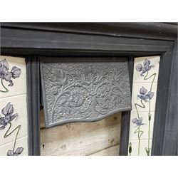The Gallery Collection Fireplaces - 'Edwardian' cast iron fireplace, the hood decorated with interlacing floral design, with Art Nouveau inspired upright tiles