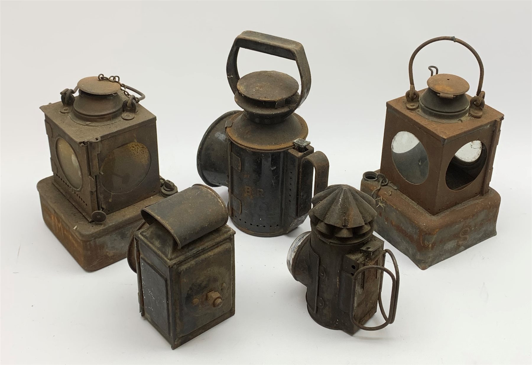  Two LNER Welch Patent railway lamps, each of typical square section form, one bearing station plaque 'Medge Hall' (on the Doncaster to Cleethorpes line) H25cm excluding swing handle, BR lamp with revolving coloured filters and two other lamps (5)  