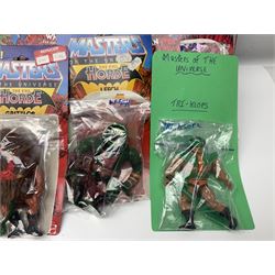 Thirty-one Masters of the Universe He-Man figures re-bagged on original backing cards;  two others lacking backing cards; boxed Modulok figure; bag of weapons and accessories; Roton, two horses and two battle cats; 1986 & 1987 Annuals; Ladybird and other story books; Panini sticker album; instructions etc