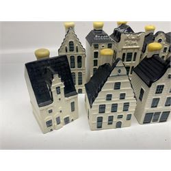 Twenty seven KLM Bols Blue Delft's decanters in the form of Dutch houses, some with contents