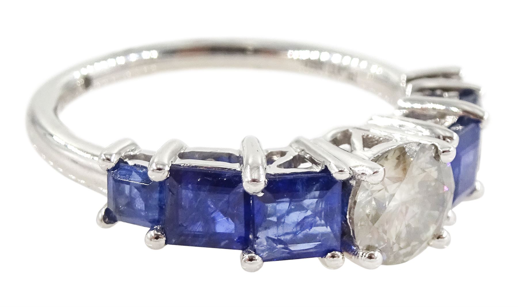 Platinum seven stone diamond and sapphire ring, the principal round brilliant cut diamond of approx 0.70 carat, with three princess cut sapphires set either side, hallmarked, total sapphire weight approx 1.95 carat