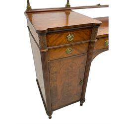 Regency mahogany twin pedestal sideboard, raised brass rail over central serpentine rectangular section with ebony stringing, fitted with single drawer, each pedestal fitted with two drawers over cupboard doors, one side enclosing cellarette drawer, the other sliding trays, flanked by canted reeded pilasters, on turned feet