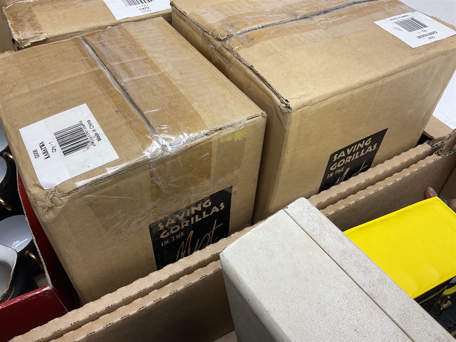 Quantity of boxed Saving the Gorillas in the Mist figures, boxed Royal Doulton glasses, art glass, ceramics etc in four boxes