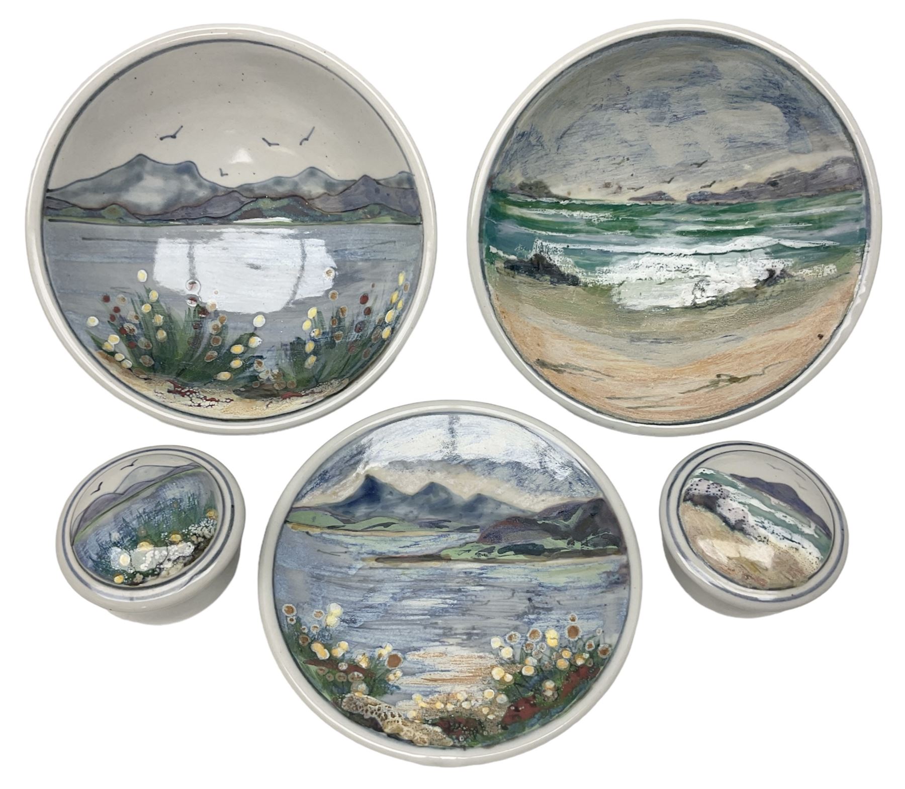 Highland Stoneware Scotland, decorated with landscapes and seascapes, comprising of two bowls, plate and two covered trinket boxes 