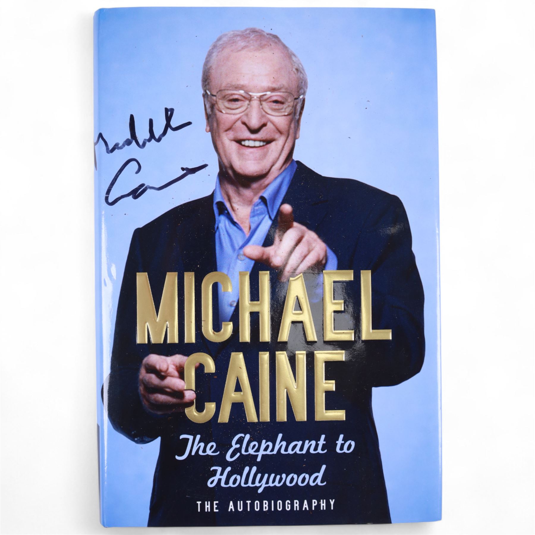 Michael Caine signed books and photographs, comprising 'The Elephant of Hollywood' autobiography and 'Blowing the Bloody Doors Off and Other Lessons in Life', black and white still from Funeral in Berlin and Sunday Times Magazine feature 'Caine on Caine'