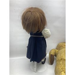 Mid-20th century woodwool filled teddy bear; and porcelain doll dressed as a WW2 evacuee