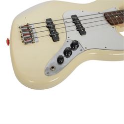Fender jazz bass guitar, serial no. MZ7182451 made in Mexico c.2007, with cream body, white scratch plate, maple neck, guitar L120cm