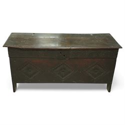 17th century carved oak kist, rectangular hinged lid above a boarded interior, the front c...