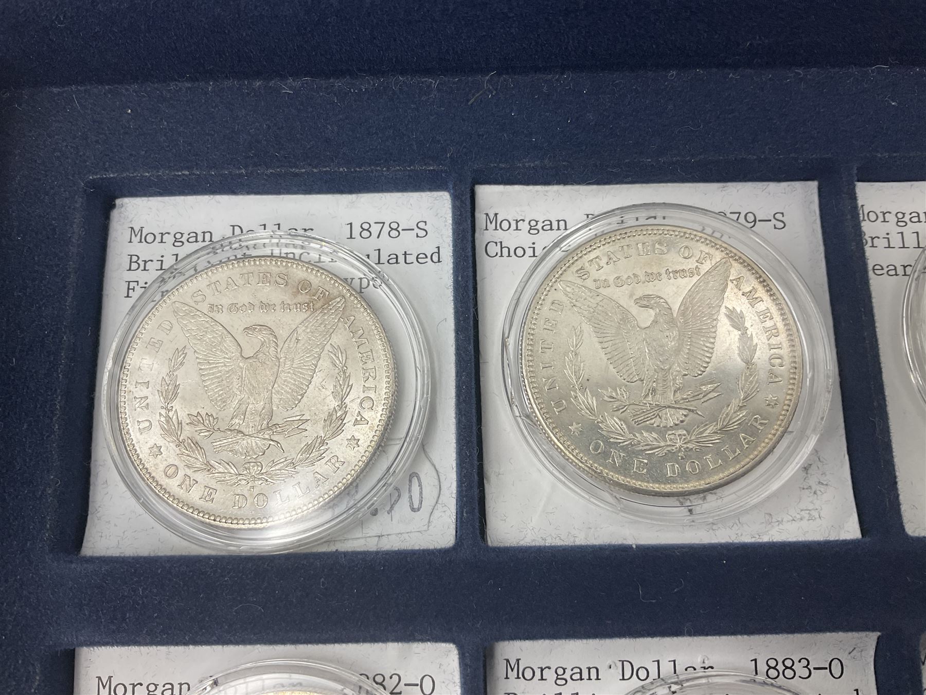 Twelve United States of America silver Morgan dollar coins, dated 1878 S, 1879 S, 1880 S, 1881 S, 1882 O, 1883 O, 1884 O, 1884 CC, 1885 O, 1886, 1887 and 1888