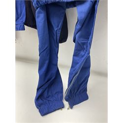 On the direct instructions of Anita Porter nee Lonsbrough Great British Olympic and Commonwealth Games gold medal winning swimmer - collection of early and international memorabilia comprising original Huddersfield Bath Club track suit top bearing eight stitched on cloth badges including British Empire & Commonwealth Games 1958 England Team, YSASA, North Eastern Counties ASA, ESSA Division 3,  English Schools Swimming Association winner etc
The swimming costume Anita wore at the 1958 Commonwealth Games in Cardiff, her first major championships, where she won two gold medals. The grey elastic on the sides, in those days, she would use to make it tighter and more streamlined.
Blue track suit from the 1960 Olympics which she wore on the podium receiving the gold medal.
1960 pool side towelling robe used at the Rome Olympics (interesting to note her name is spelt wrong on the embroidered label).
1962 Commonwealth Games pool side towelling robe used in Perth Australia when winning three Gold medals. 
It was also this year she became BBC Sports Personality of the year, the first female to do so.
Her 'lucky' pool side towel which she took with her to every event she competed in and which can be seen round her neck in many official celebratory photographs. Copies of some of these photographs are included for identification.
In addition there are two souvenir programmes of an evening event to honour Anita at The Theatre Royal Huddersfield and she has kindly signed the front cover on one of these.