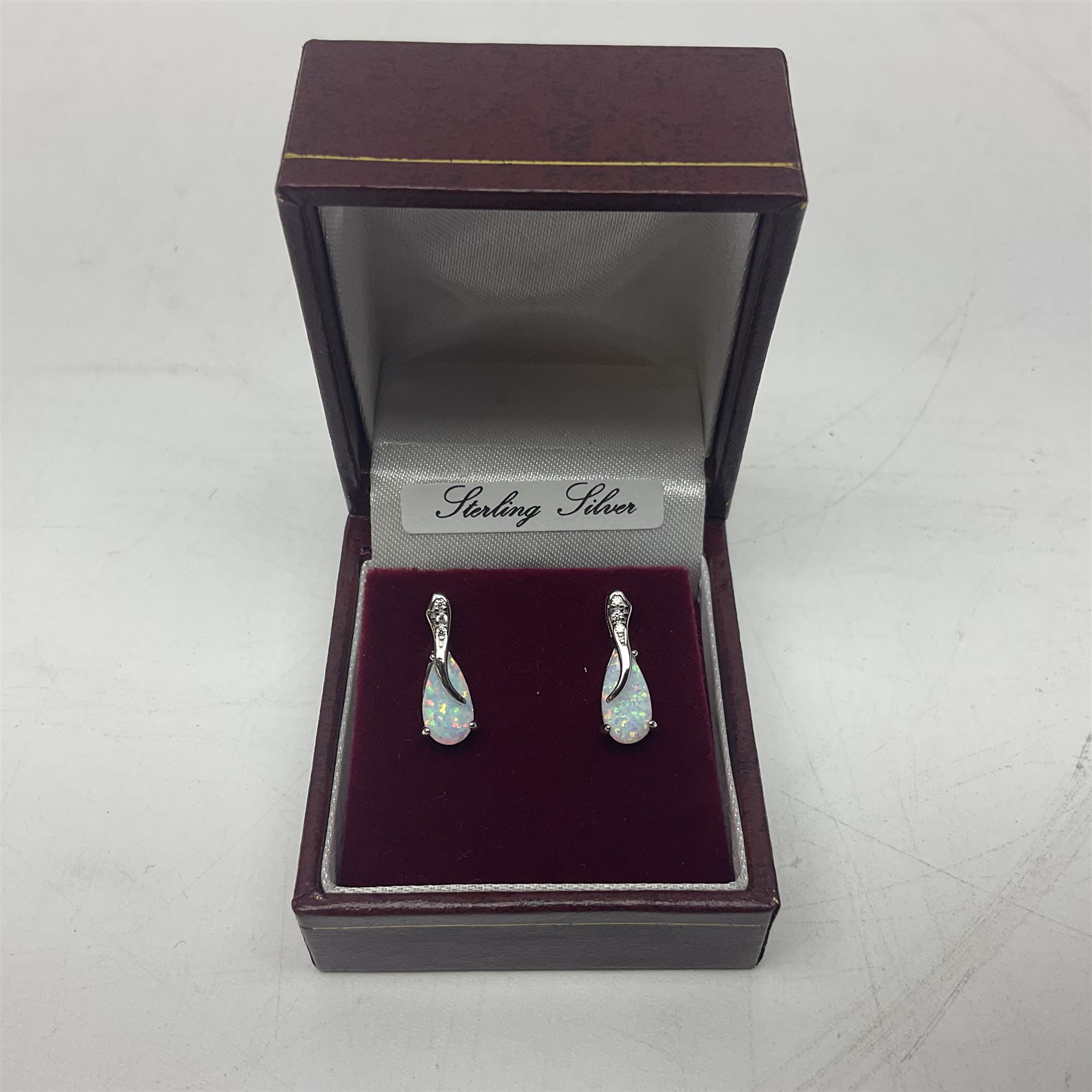 Pair of silver opal and cubic zirconia stud earrings, stamped 925, boxed 