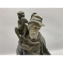 Lladro figure, Organ Grinder, modelled as an elderly man playing his hurdy gurdy instrument with a monkey seated upon his shoulder, sculpted by Salvador Furió, with original box, no 5046, year issued 1980, year retired 1981, H34cm