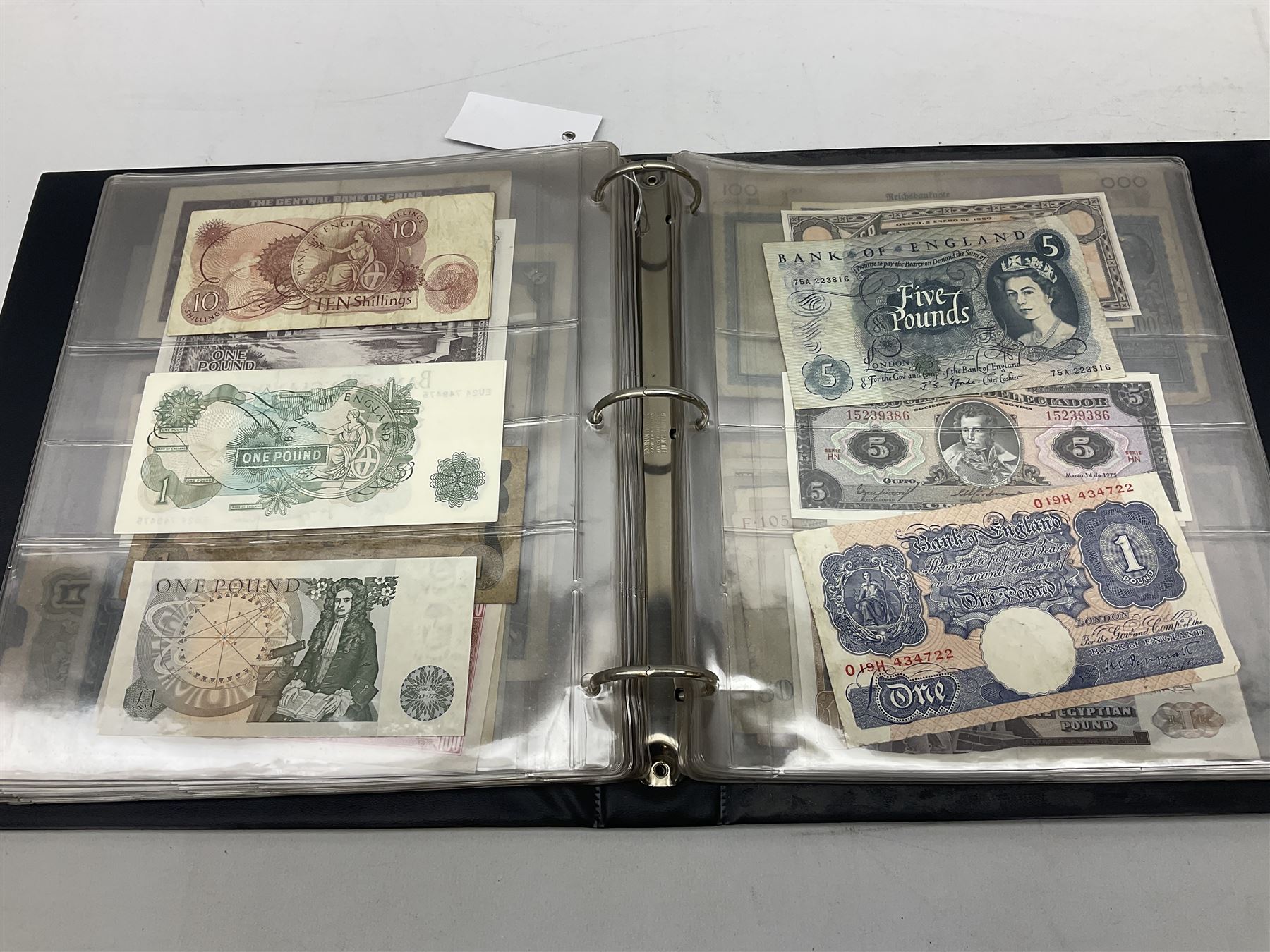 World banknotes, including Queen Elizabeth II The States of Jersey one pound 'DB202703', five pounds 'BB527762' and ten pounds 'AB651481', reserve bank of New Zealand two dollars '1L3 741894', King George V Straits Settlements one dollar 1st January 1935 'F/83 28924', various Bank of England notes etc, housed in two ring binder albums
