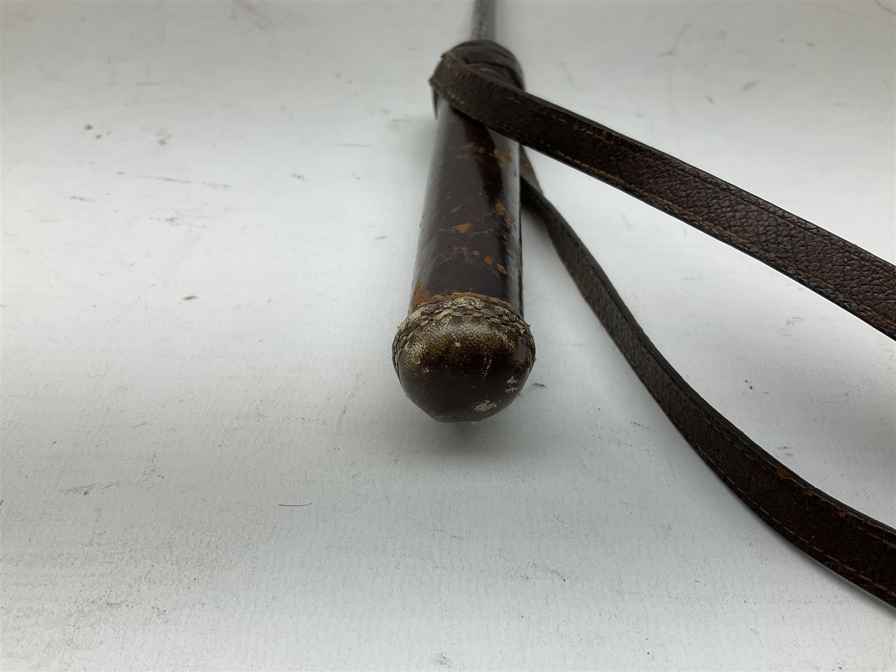 Early 20th century officer's swagger type leather covered sword stick, the 33cm etched single fullered blade marked Wilkinson Pall Mall, with carrying strap L60.5cm